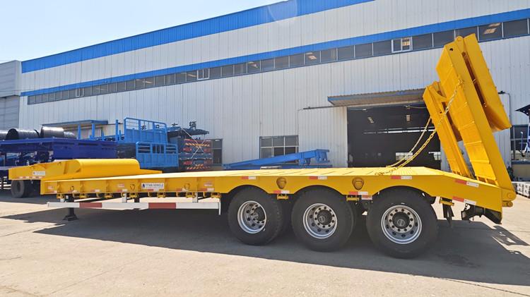 Tri Axle Low Bed Trailer with Folding Ramp in Angola